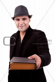 happy man standing  offering a book, isolated on white, studio shot