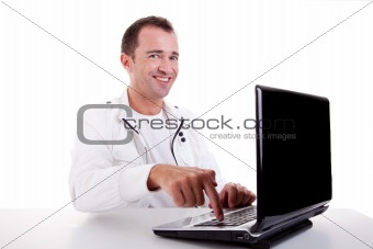happy man looking to camera, put the finger on computer, isolated on white background. Studio shot.