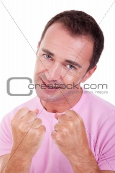 smiling man punching fist isolated on white, studio shot