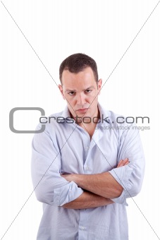 handsome man upset with his arms crossed, isolated on white background. Studio shot.