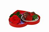 Strawberries in chocolate on red heart shaped tray with rose