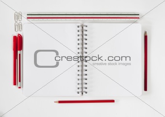 Open notebook with stationaries