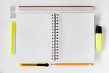 Open notebook with stationaries