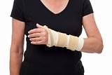 Woman's injured wrist and arm in splint