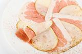 Sliced bacon with sliced pear