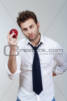 man in white shirt and tie holding red apple looking - isolated on gray