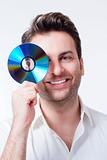 man in shirt standing smiling holding CD - isolated on white