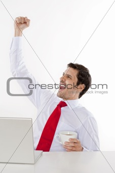 young business executive in white shirt and red tie cheering - isolated on white