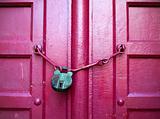 Green Key on Red Wood Door