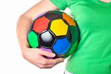 Colored soccer ball in a girl's hand