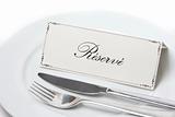Reserved sign in french with fork and knife