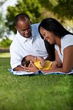 Loving couple with newborn at the park