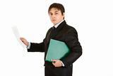 Serious modern businessman holding folder and exploring documents
