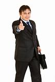 Elegant businessman with briefcase in hand pointing finger at you
