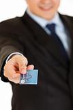 Businessman giving credit card.  Close-up.

