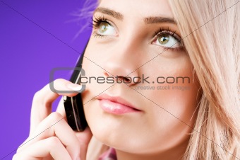 Blond girl talking on mobile phone