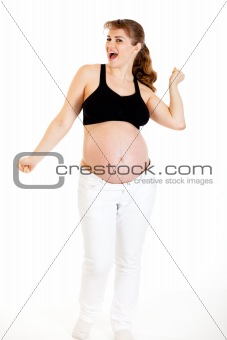 Dancing beautiful pregnant woman isolated on white
