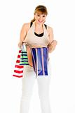 Smiling pregnant woman  checking shopping bag
