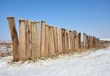 winter landscape with a wooden fence