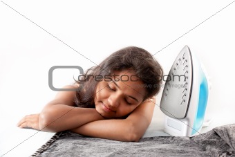 Indian girl sleeping  and electric steam iron
