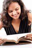 Indian girl enjoying reading book