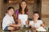 Mother, Son & Daughter Family In Kitchen Cooking Baking 