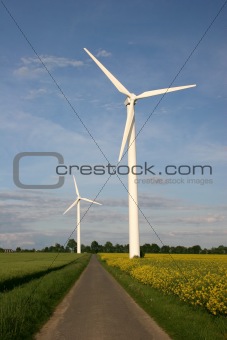 Wind farm with rapeseed field and footpath