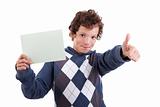 cute boy with a paperboard in hand giving consent, with thumb up, isolated on white background. Studio shot.