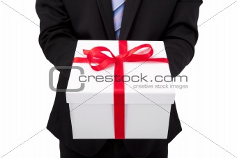 Businessman holding a gift box