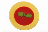 tomato soup in yellow plate
