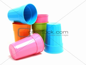 Plastic cups of various color isolated on white