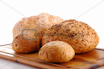 Loaf of bread and rolls isolated on white