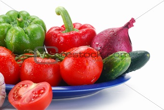 Composition with fresh raw vegetables isolated on white