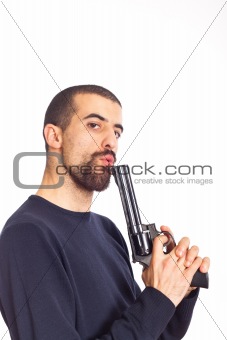 Young Man Blowing on His Gun After Shooting