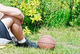 Young basketball player relax and rests after game