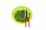Hot peppers with chopsticks and plate