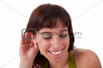 Young woman, listening and smiling, viewing the  gesture of hand behind ear, isolated on white, studio shot