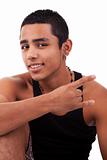 Young latin man with thumbs raised as cool signal , isolated on white background. studio shot