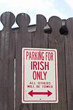 Parking for Irish Only Sign on an Old Fence.