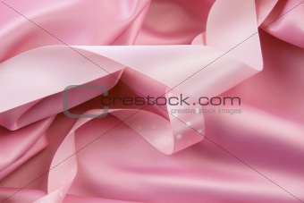Pink satin silk  background with ribbons
