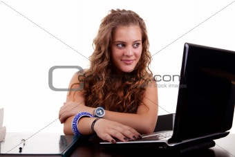 beautiful and happy blonde young woman,looking to computer, isolated on white, studio shot