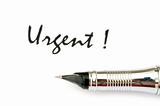 Pen and urgent message  - focus on the pen