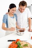 Lovely couple preparing a bolognese sauce together
