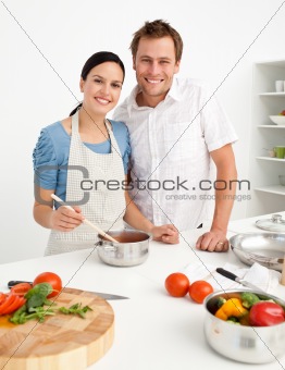 Portrait of a happy couple preparing a bolognese sauce together