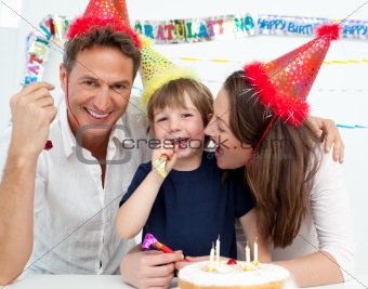 Portrait of a family celebrating little boy's birthday