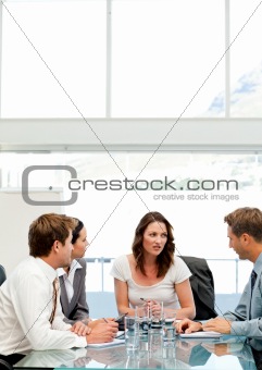 Charismatic businesswoman talking to her team 