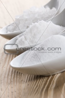 three spoons with different salt 
