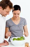 Cute couple preparing a salad together