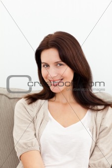 Portrait of a cute woman sitting on the sofa