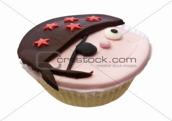 Cupcake with pirate face isolated over white